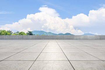 Empty square floor and green mountain scenery