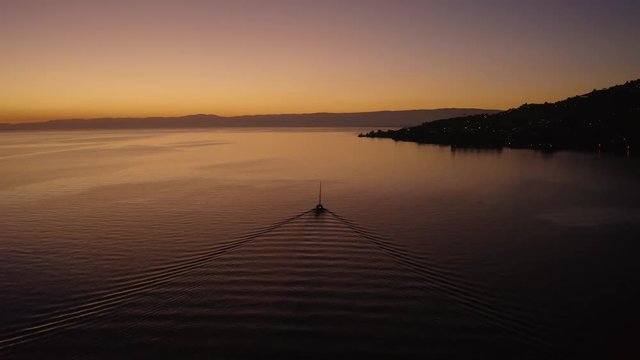 Following sailboat on Lake L&radic;&copy;man with beautiful sunset colors
In front of Cully, Lavaux - Switzerland