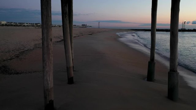 Drone flying through a wooden pier at Belmar, New Jersey