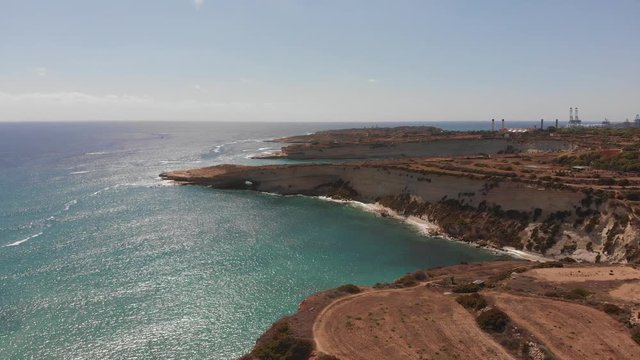 Aerial drone video from eastern Malta, Marsaxlokk area, Il-Hofra l-Kbira bay.