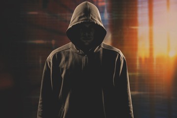 Thief in black clothes on grey background