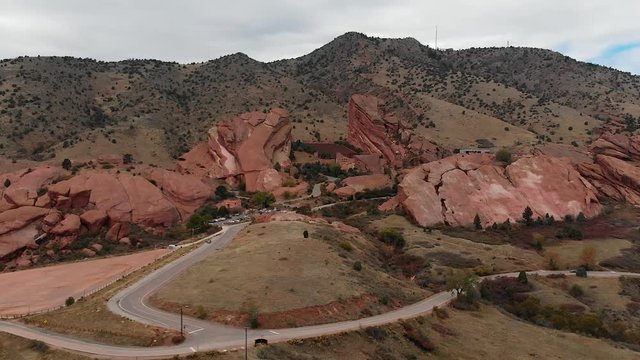 Aerial shot pulling away from Red Rocks Amphitheater in the fall.