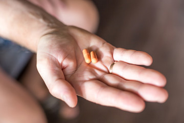 pills in a man's palm