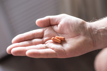 pills in a man's palm