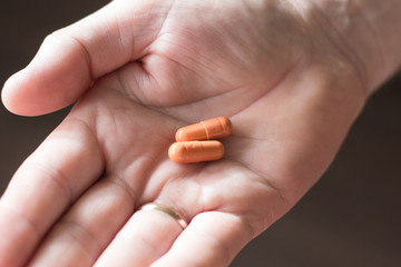 pills in a man's palm