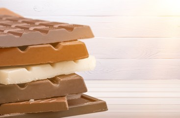 Delicious chocolates isolated on  background