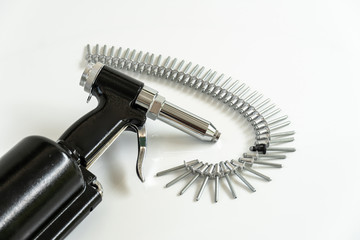 Rivet Gun and Rivets , Pneumatic rivet gun and Pop rivets on a white background.