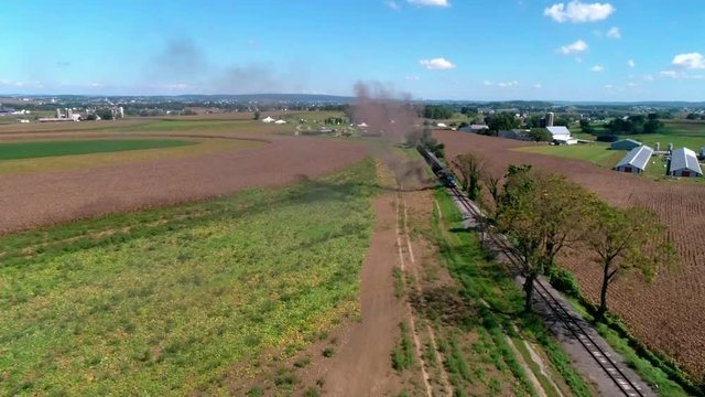 Thomas the Train with Passenger Cars Puffing along Amish Countryside