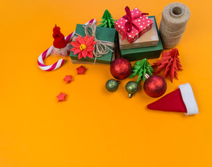 Packed gifts with a bow on an orange background