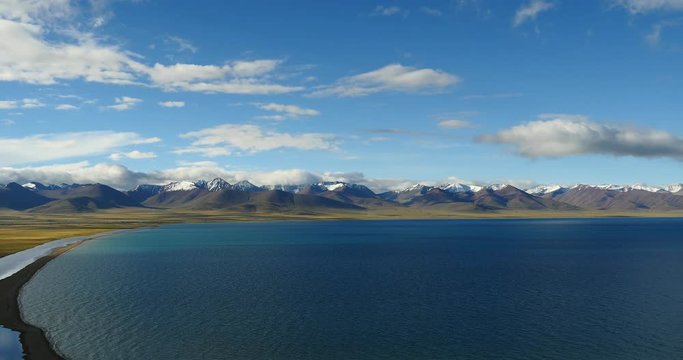 4k huge clouds mass rolling over lake namtso & mountain peak,mansarovar,Tibet's second largest lake,is the third largest saltwater lake in China.Danggula Mountains in xizang Plateau,roof of the World