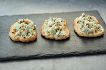 Sandwich, grilled baguette with blue cheese, honey and pine nuts