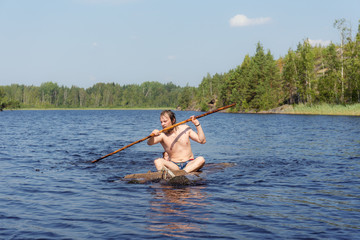 Fototapeta na wymiar wooden raft on a forest lake