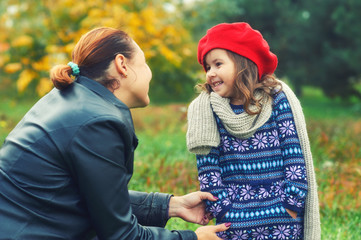 Mother and daughter on autumn walk in the Park