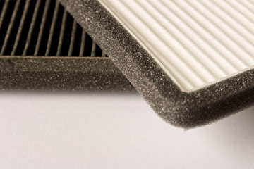 New and old car air filter. Close up.