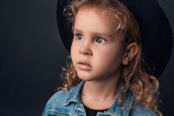 child in the Studio posing in fashionable clothes