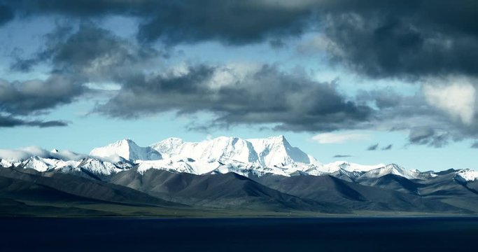 4k time lapse of huge clouds mass rolling over lake namtso & Tanggula snow mountain peak,tibet mansarovar,Tibet's second largest lake,is the third largest saltwater lake in China,xizang Plateau