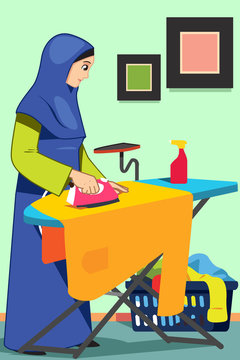 Muslim Woman Ironing Clothes at Home