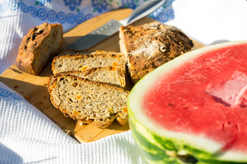 Watermelon and bread on the tablecloth