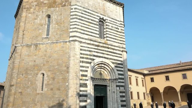 Tilt of ancient baptistery of San Giovanni, Volterra, Tuscany, Italy. Beautiful old religious building with stripes facade 11th century Romanic style. Italian holiday, sightseeing, tourism destination