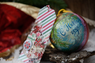 Christmas Decorations: Balls, fir branches, ribbons, straw toys and postcards