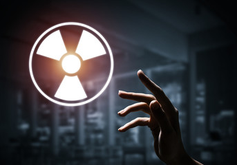 Science concept presented by atom symbol on dark interior backgr