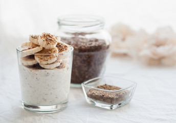Kefir in a glass with milled flax seeds and banana