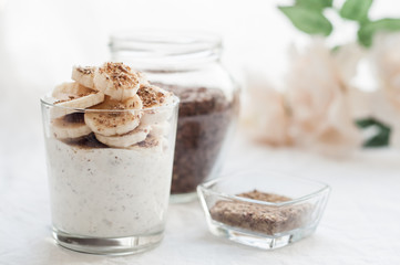 Kefir in a glass with milled flax seeds and banana