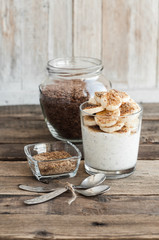 Kefir in a glass with milled flax seeds and banana
