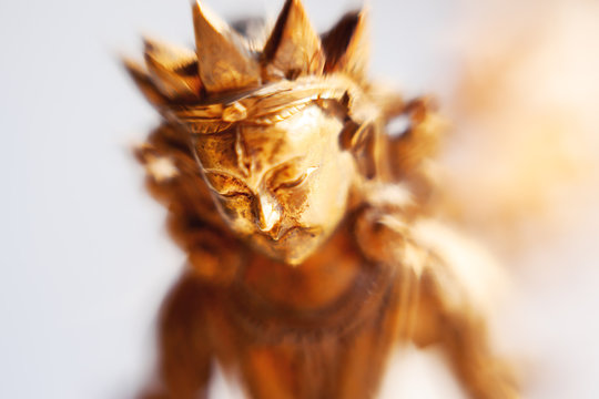 Close up photo of unknown goddess statue. Old rusty metal sculpture captured with Lens Baby Sweet 35mm.