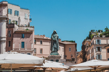 Campo de' Fiori with the monument to philosopher Giordano Bruno with daily market