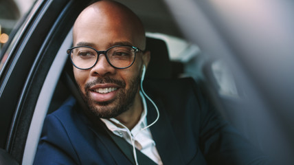 African business man driving car to office