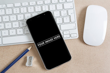 Modern smartphone on a keyboard