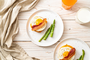 fried egg with bacon and cheese on pancake