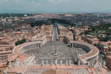 Saint Peters Square in the Vatican and an aerial view of the rooftops of Rome, Italy in a travel...