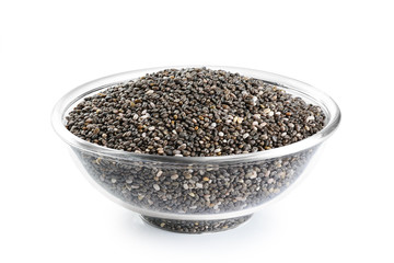 Glass bowl with chia seeds isolated on white background.