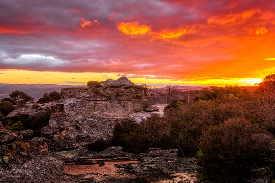 Sunset skies looking across the cliff to the distant mountains