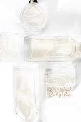 Background of transparent perfume bottles. Cosmetic concept.