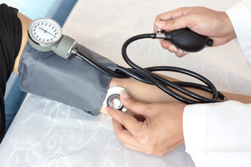 Female doctor measuring blood pressure, Healthy concept