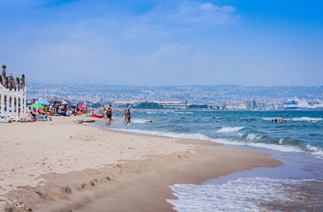 Catania, Sicily, Italy – view of town from the beach Lido Cled