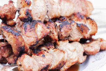 Barbecue meat, grilled pork skewers, shashlik kebab on plate