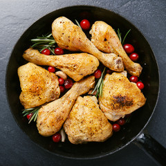 Tasty baked chicken legs with spices on pan