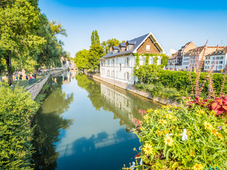 Strasbourg, France - Aug 18, 2018: Picturesque canals in La Petite France in the medieval fairytale old town of Strasbourg, UNESCO World Heritage Site, Alsace, France.