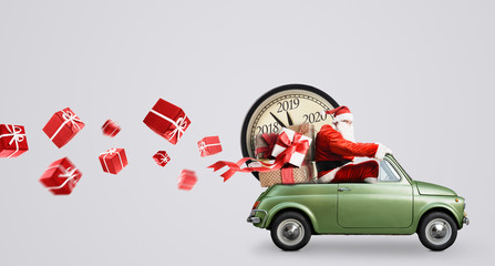 Christmas countdown arriving. Santa Claus on car delivering New Year gifts and clock at gray background