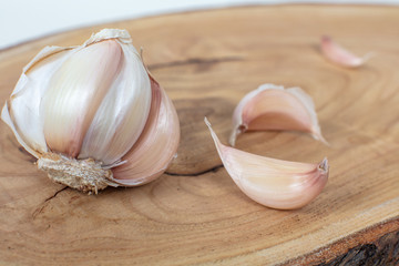 Garlics isolated  on wooden background with shadows