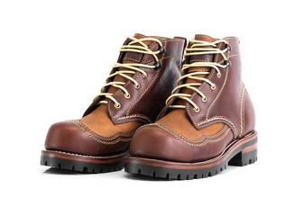 Brown oil full grain men’s boot with steel toe for biker isolated on white background. Fashion advertising boot photos.