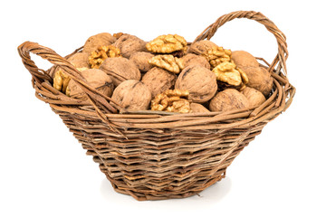 Walnut in a basket isolated over white background.