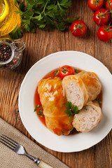 Traditional stuffed cabbage with minced meat and rice, served in a tomato sauce.