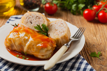 Traditional stuffed cabbage with minced meat and rice, served in a tomato sauce.