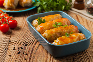 Traditional stuffed cabbage with minced meat and rice, served in a tomato sauce.