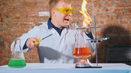 A scientist conducts an experiment and his hand lights up